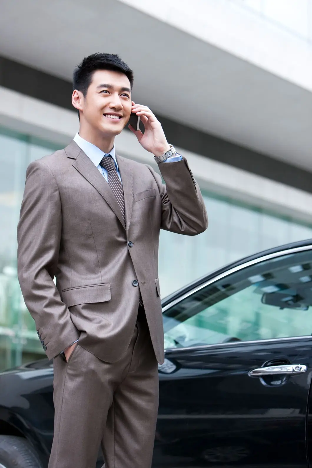 young-businessman-on-the-phone-PF6QW7H.jpg